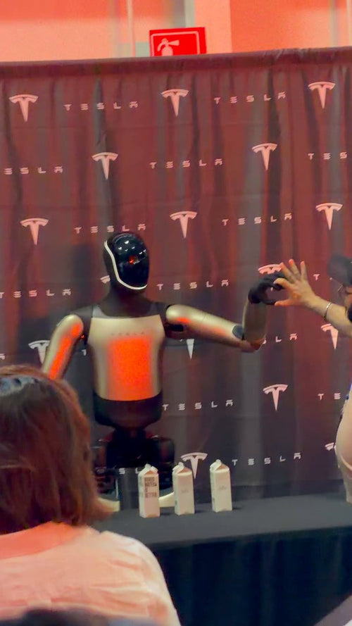 Tesla Optimus Caught Handing Out Water in New Demo